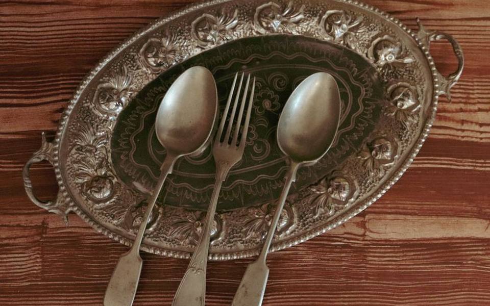 The safest method for polishing antique flatware by hand